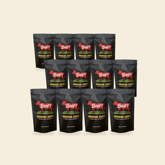 Twelve bags of Beef't Premium Jerky, the Whole Herd 12-Pack, on a cream background