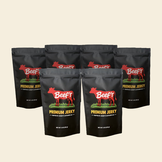Six bags of Beef't Premium Jerky lined up on a cream background
