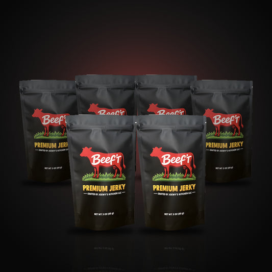 Six bags of Beef't Premium Jerky lined up on a dark background