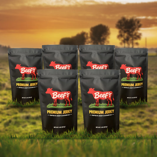Beef't Premium Jerky Crowd Pleaser 6-Pack, six bags standing in a farm pasture at sunset
